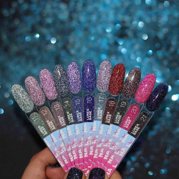 Nail polish bottle with 'Luna' branding and a black glittery nail sample on a pink background